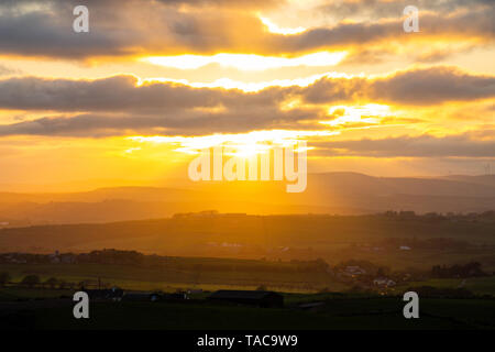 Knockdrum Stone Fort, West Cork, Ireland, 23rd May 2019, The sun sets over Knockdrum Stone Fort an ancient stone monolith in Castlehaven West Cork. County Kerry can be seen in far distance looking out over the countryside of West Cork. Credit aphperspective/ Alamy Live News Stock Photo