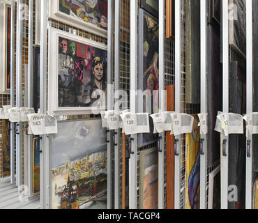 20 May 2019, Brandenburg, Beeskow: View into the heart of the new art archive with its innumerable pull grids to which pictures from the GDR era are attached. 30 years after the fall of communism, GDR art is finding interest again, especially among those who did not experience this state for themselves. The Beeskow Art Archive wants to make a contribution to this with its new open depot. It has around 23,000 GDR commissioned works of art in its inventory, which are now more easily accessible. The art archive is scheduled to open on 29.05.2019. Photo: Patrick Pleul/dpa-Zentralbild/dpa Stock Photo