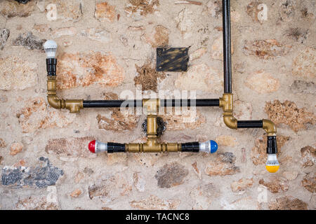 Lighting equipment made of water pipes Stock Photo