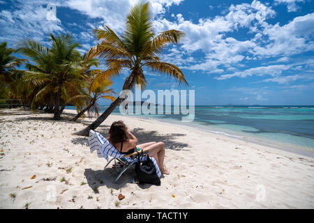 Mustique Island is an exclusive, paradise, getaway and Caribbean destination with a beautiful fishing village and white sand beaches. Private Island. Stock Photo