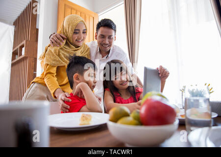 kids and parent using tablet pc Stock Photo
