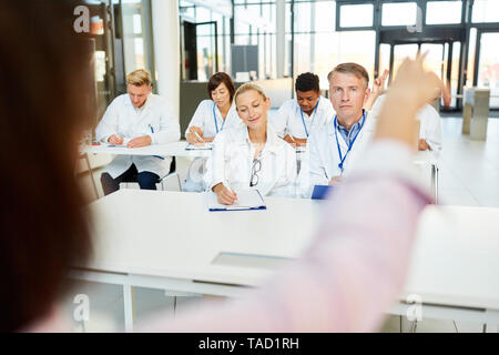 Lecturer holds a medicine lecture on continuing education for doctors and nurses Stock Photo