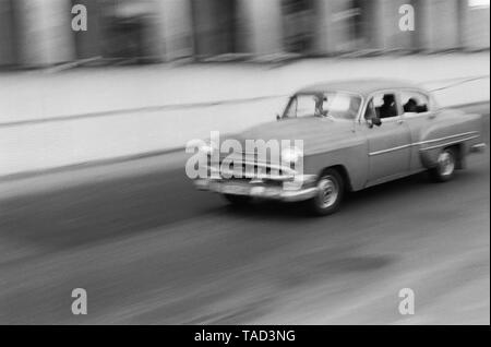 An American car speeds through the city of Havana Cuba Stock Photo