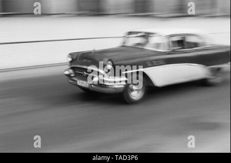 An American car speeds through the city of Havana Cuba Stock Photo