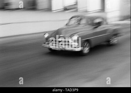 An American car speeds through the city of Havana Cuba Stock Photo