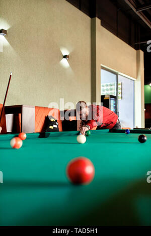 Man playing billiards Stock Photo