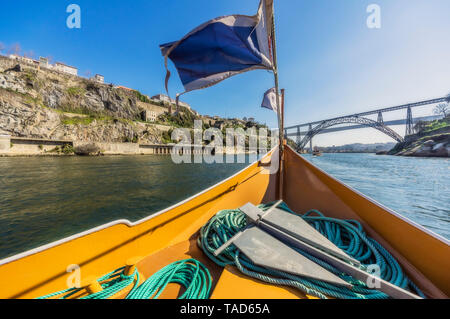 Portugal, Porto, Douro river, pleasure boat and Luiz I Bridge in the background Stock Photo