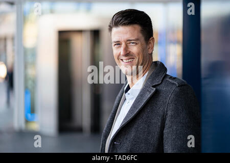 Portrait of smiling businessman outdoors Stock Photo