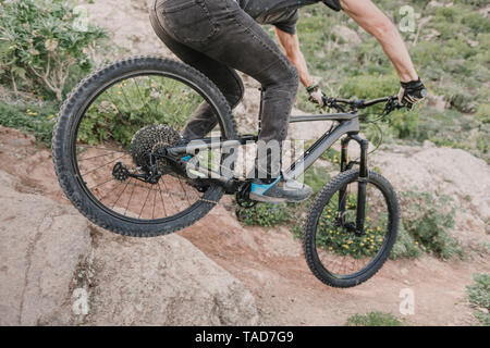 Spain, Lanzarote, close-up of mountainbiker on a trail in the mountains Stock Photo