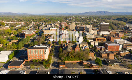 Long shadows light up the buildings in the hilltop village of Lynchburg Virginia Stock Photo