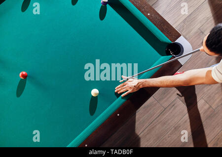 Top view of man playing billiards Stock Photo