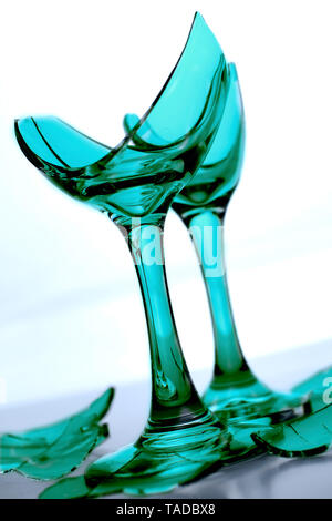 Broken Champagne Glass with shards of glass  and shattered glass on white background Stock Photo