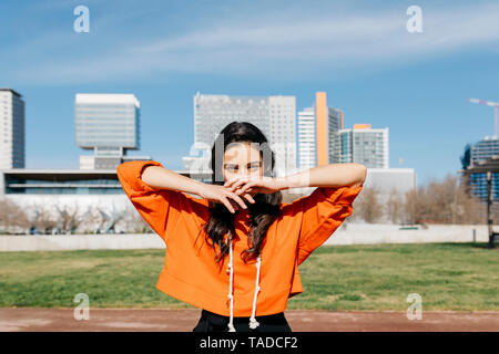 Young contemporary dancer wearing red hoodie shirt Stock Photo