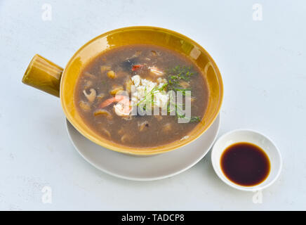 Braised Fish Maw in Red Gravy with Crab and shrimp in bowl / Chinese styled food fish maw soup and sauce Stock Photo