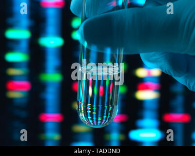 Genetic Research, DNA profile reflected in a test tube containing a sample Stock Photo
