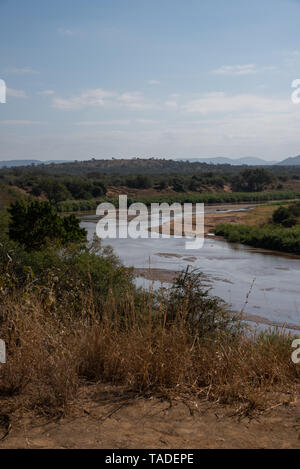 The Black Umfolozi River meandering through the African bush, South Africa. Stock Photo