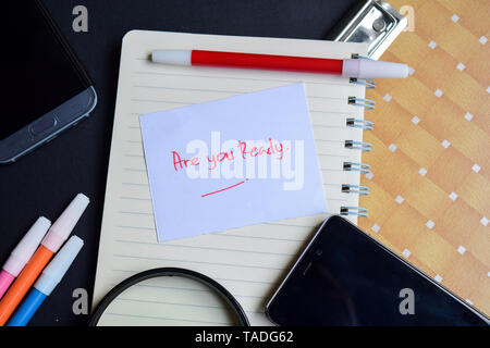 Are you Ready written on paper isolated on black table Stock Photo