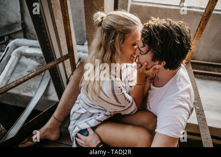 Young couple kissing in an old building Stock Photo