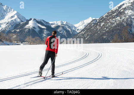 Austria, Tyrol, Achensee, man doing cross country skiing Stock Photo