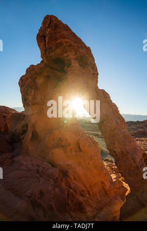 USA, Nevada, Redrock sandstone arch at sunrise in the Valley of Fire State Park Stock Photo