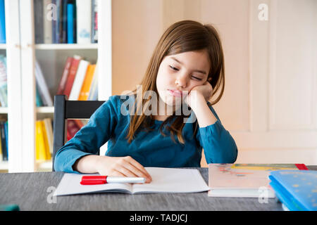 Frustrated girl with homework Stock Photo