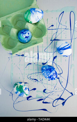 Easter eggs painted with blue and green nail varnish Stock Photo