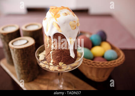 Home-baked Easter cake with icing decorated with sliced almonds Stock Photo