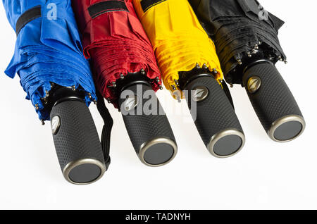 Multicolored folded umbrellas isolated on white Stock Photo
