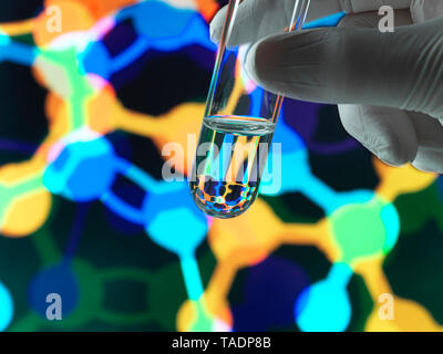 Biotechnology research, Test tube containing a chemical formula with a illustration of structure on the screen in the laboratory