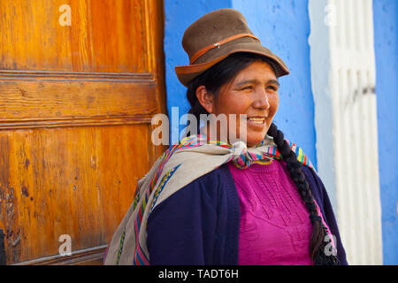 peruvian lady selling dolls Stock Photo