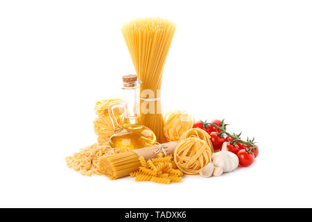 Pasta, olive oil, tomatoes and garlic isolated on white background. Uncooked whole wheat pasta Stock Photo