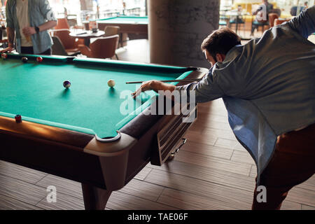 Man playing billiards Stock Photo