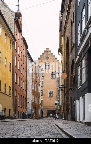 Denmark, Copenhagen, Narrow alley with cobblestone pavement in the old town Stock Photo