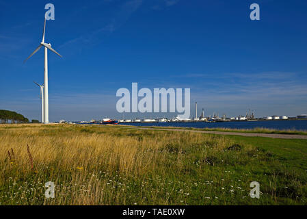 port of rotterdam, netherlands - 2017.07.17:  europoort petrochemical port, caland kanaal, tank storage facilities and wind power generators Stock Photo