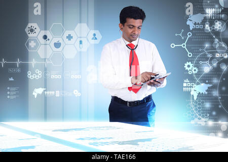 doctor at hospital using a digital tablet Stock Photo