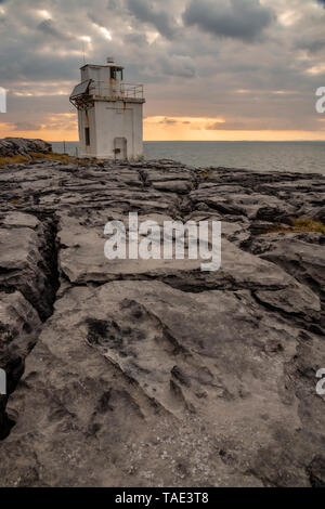 Black Head lighthouse and limestone pavement, Burren, County Clare, Ireland Stock Photo