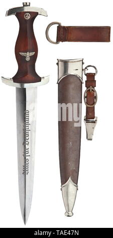 SA-Obersturmführer Josef Eichbauer (1903 - 1944) - a dagger M 33 with engraved name Maker Eickhorn, Solingen. Good blade with etched motto and maker's logo. Brown wooden grip with nickel silver eagle and enamelled SA emblem. Nickel silver mountings, quillons punched 'BO'. Burnished scabbard (spotted) with nickel silver mountings and two-part leather hanger, locket engraved 'Sepp Eichbauer' in-between tendril pattern. Length 35 cm. Also see his 'Blutorden' and further decorations in lot no. 6460 chapter 'Orden' (medals). historic, historical, 20th century, 1930s, 1940s, stor, Editorial-Use-Only Stock Photo