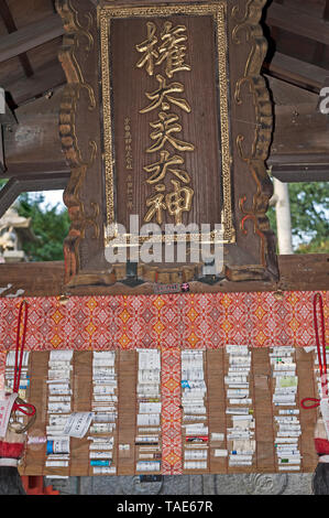 Paper wishes at the Fushimi Inari Shrine in Southern Kyoto, Japan. Stock Photo