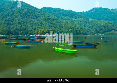 Phewa Lake is Famous and Beautiful Lake in Pokhara Nepal,Lots of colorful Boats Parking at Lake. NEPAL Stock Photo