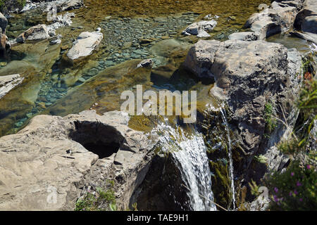 At foot of the Black Cuillins near Glenbrittle are the Fairy Pools, beautifully crystal clear blue pools on the River Brittle. Stock Photo