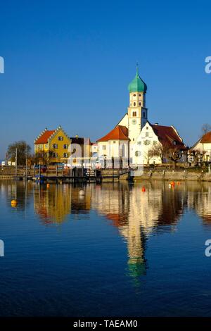 Church of St. George, moated castle at Lake Constance, Swabia, Bavaria, Germany Stock Photo