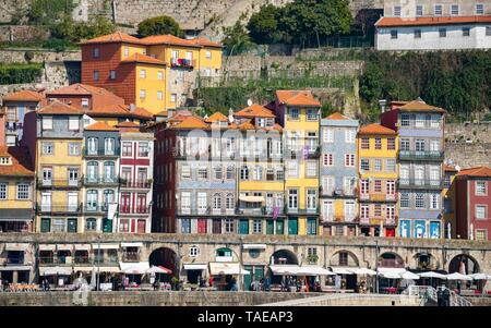 Colourful houses in the district Ribeira, Cais da Ribeira, promenade at the Rio Douro, Porto, Portugal Stock Photo