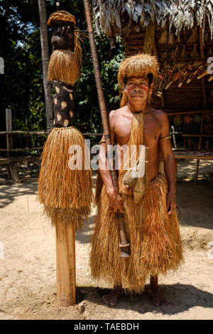 Portrait of a Yagua tribe male member holding a blowpipe (or pucuna) on the Yagua village of Nuevo Perú, Peruvian Amazon, Loreto Department, Peru Stock Photo