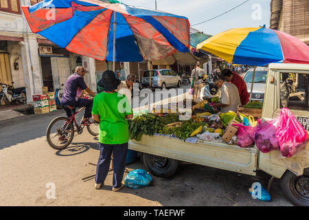 Malaysian Grocery Shoppers in a shopping frenzy at a Vegetable