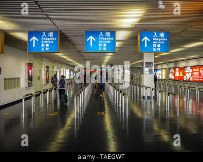 NOVEMBER 2018 - Macau: The customs border at the Outer Harbour Ferry Terminal in Macau with an entrance sign in five languages Stock Photo