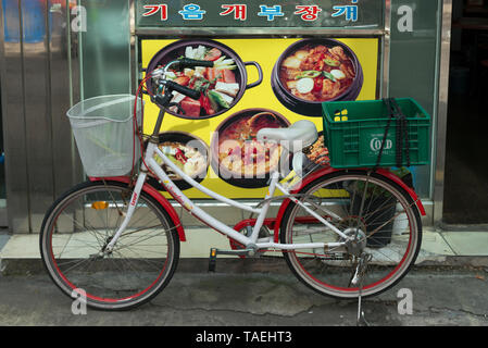 Bicycle parked in front of a restaurant, Seoul, South Korea Stock Photo