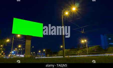 Green screen billboard on highway with traffic Stock Photo