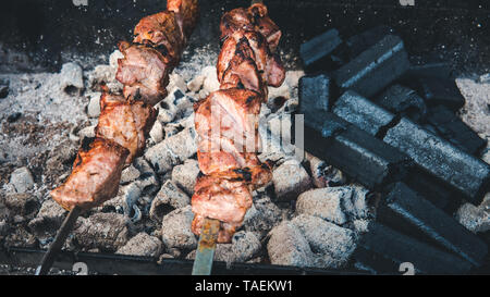 The meat is on charcoal close-up outdoors. Street food. Barbecue season Stock Photo