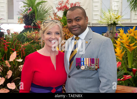 Lance Sergeant Johnson Beharry, VC, who was awarded the Victoria Cross seen at the Chelsea Flower Show with weathergirl Carol Kirkwood. Stock Photo