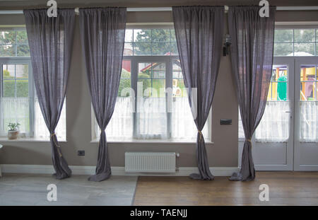 Curtain interior decoration in living room with sunlight . New modern window with curtains in room .Empty curtain interior in bedroom with sunlight .P Stock Photo